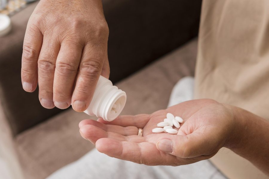 close-up-hand-holding-pills