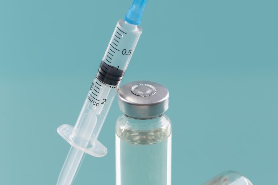 coronavirus-arrangement-with-vaccine-bottle-syringe